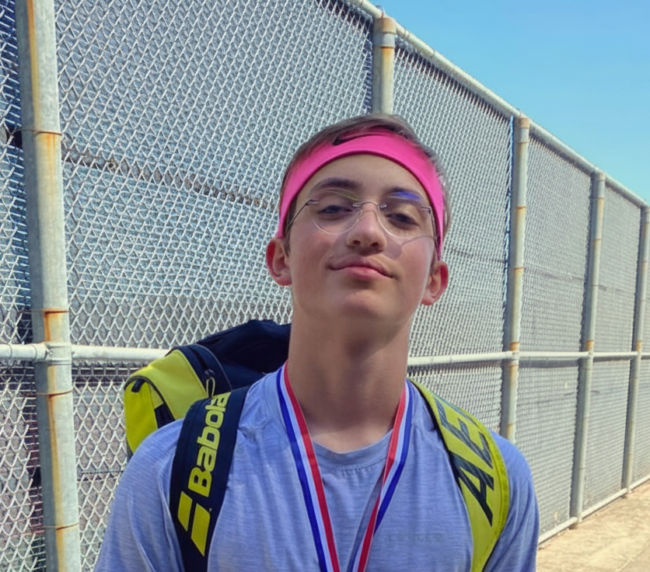 Teenage tennis player Oscar celebrating with a medal and tennis bag after winning a tournament in Sugar Land.