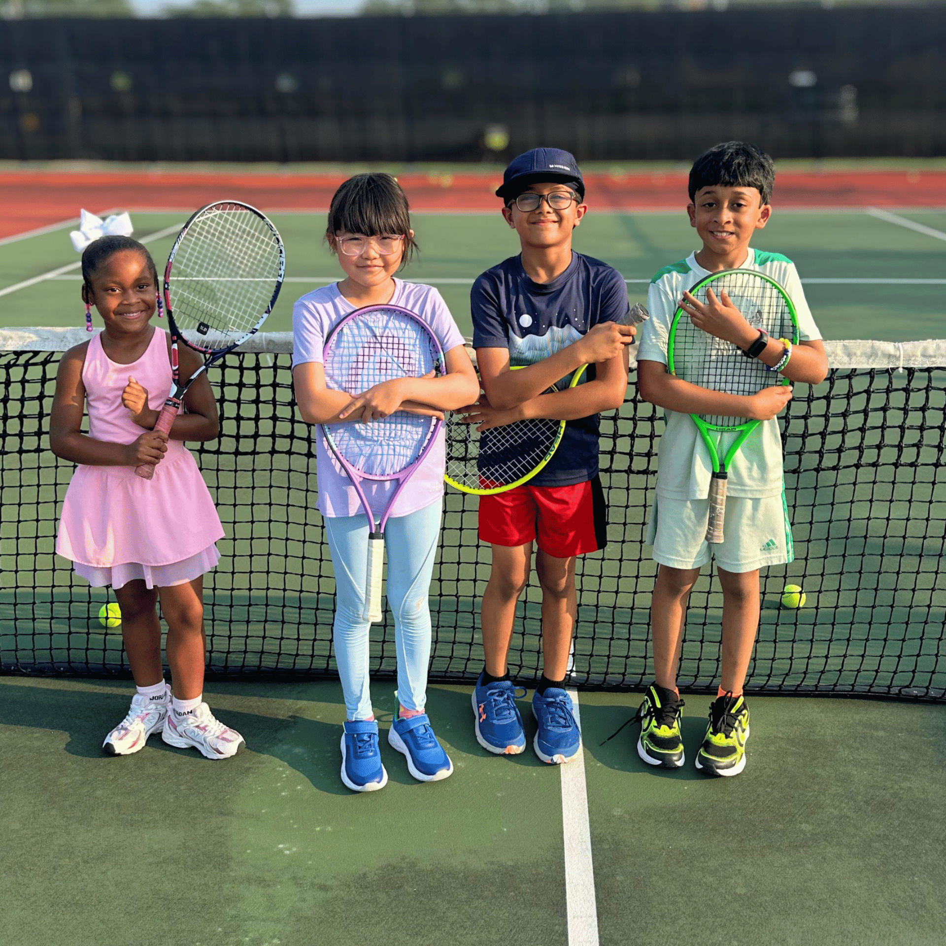 Young tennis players training at Kuku Tennis Academy, Sugar Land, TX