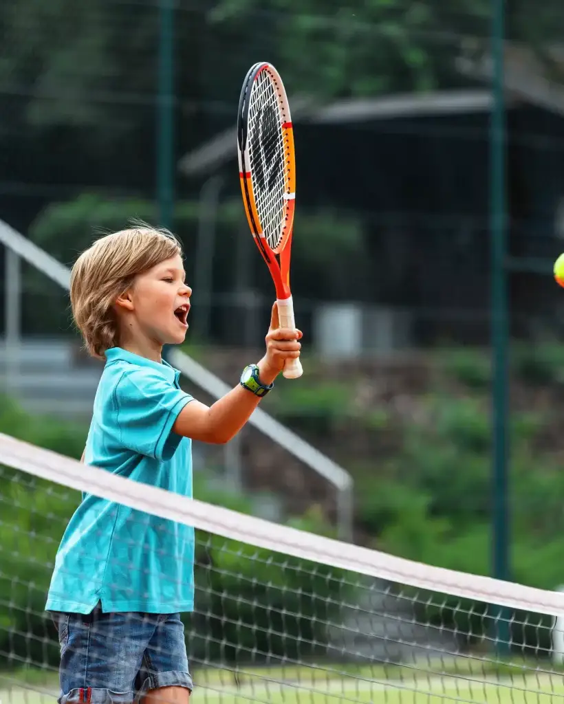 child-in-tennis-lesson-learning-to-hit-ball-2022-11-11-08-31-35-utc-jpg